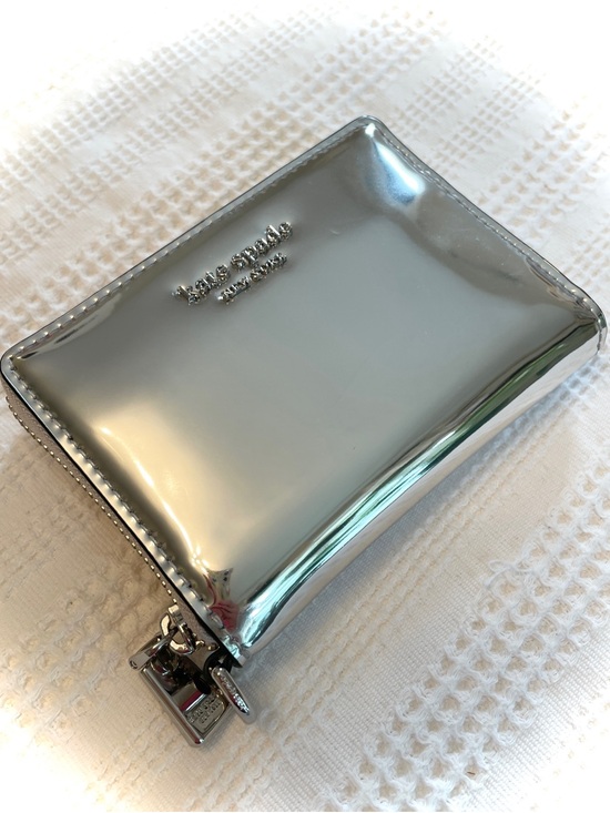kate spade Handbags - NWT Kate Spade Metallic Silver Natasha Compact Wallet